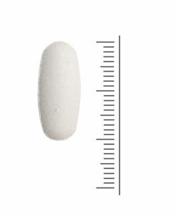 L-lysine tablet naast een liniaal als indicatie van het formaat